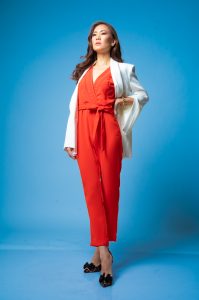 A sophisticated-looking realtor is shown in a full-body shot, exuding professionalism and confidence.The image captures her strong presence and can be used to solidify her personal brand as a successful and reputable realtor.